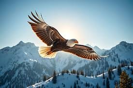 download (7) Águia voando no céu azul com montanhas ao fundo